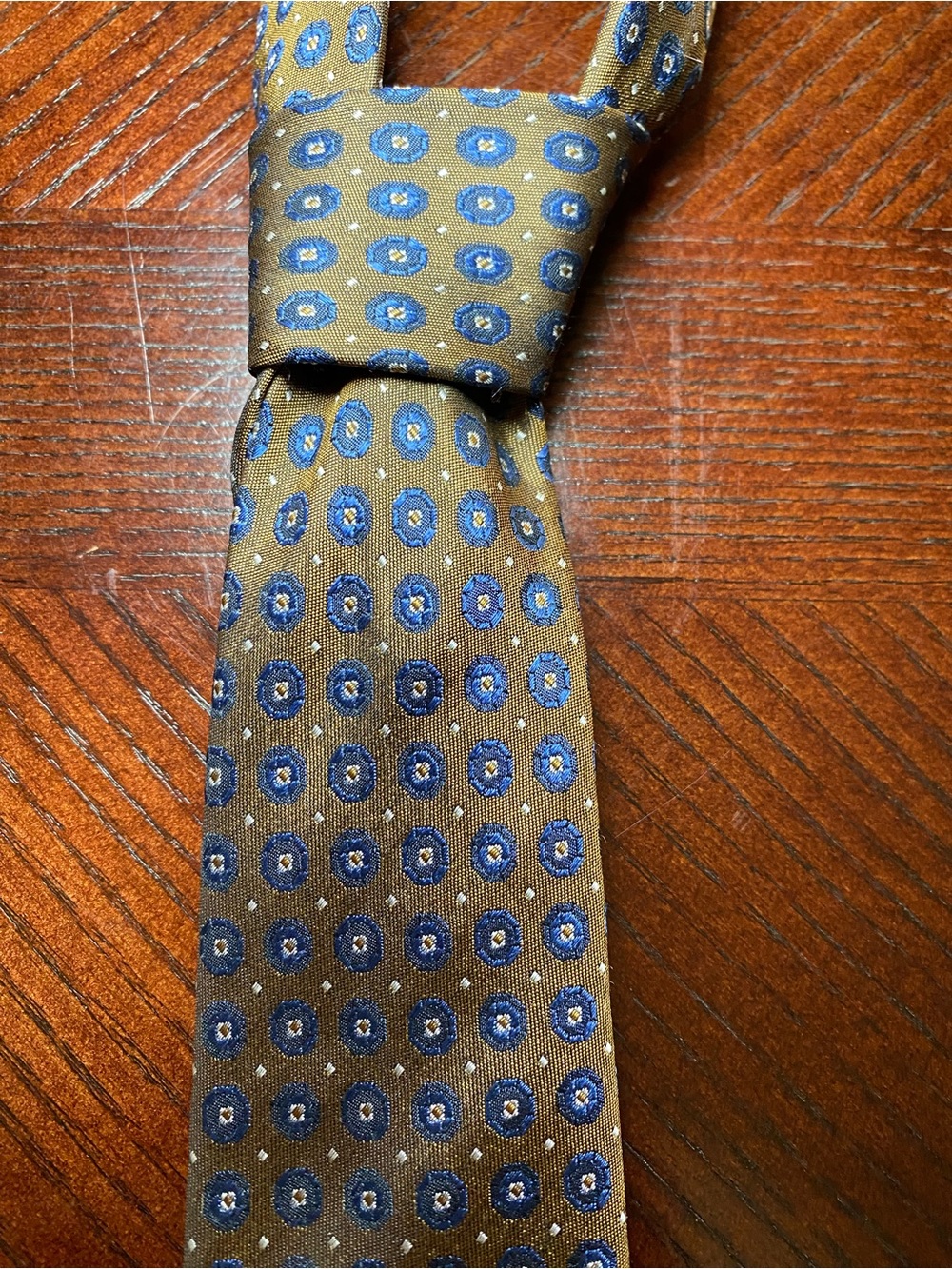 Indochino Men’s Brown Pattern Silk Tie with Blue and Cream Medallions